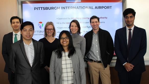Heinz College students gather after presenting their capstone project.