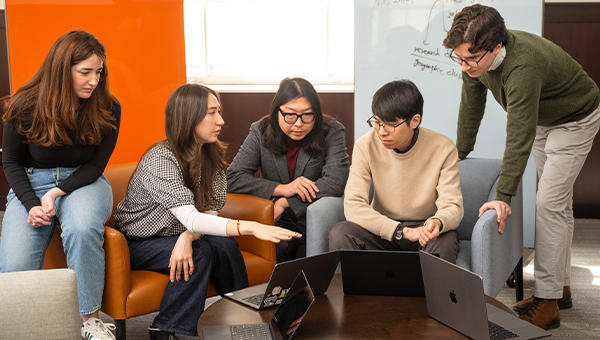 Master’s students Henry Albright, Shawn Lu, Ana Rowley, Isabella Veneris and Albert Yang work on their project..